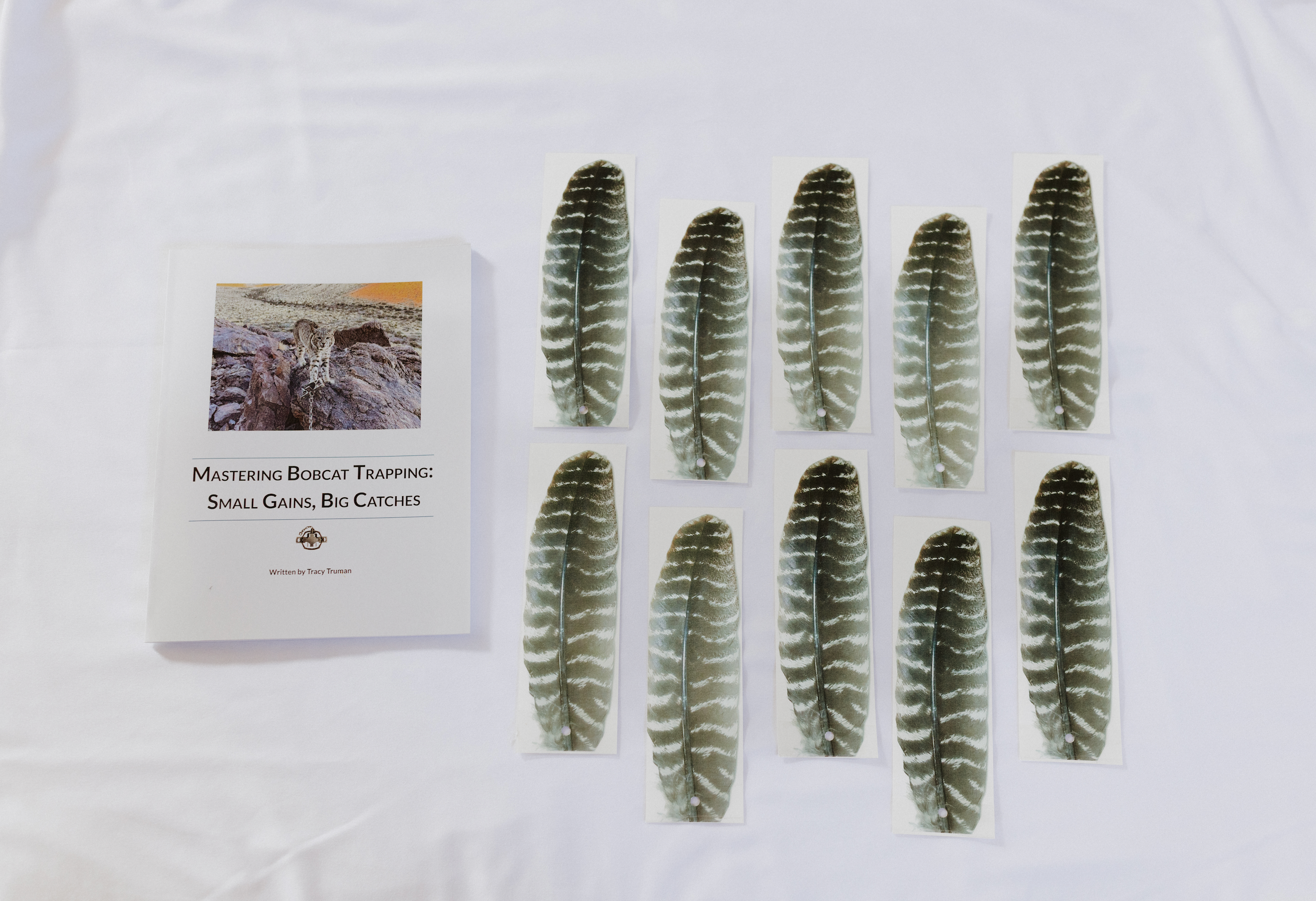 Mastering Bobcat Trapping Book & Enticer Turkey Feather Bundle